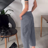 Pantaloni casual asimmetrici a tinta unita