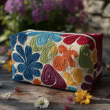 Pochette beauty a fiori con motivo armonioso